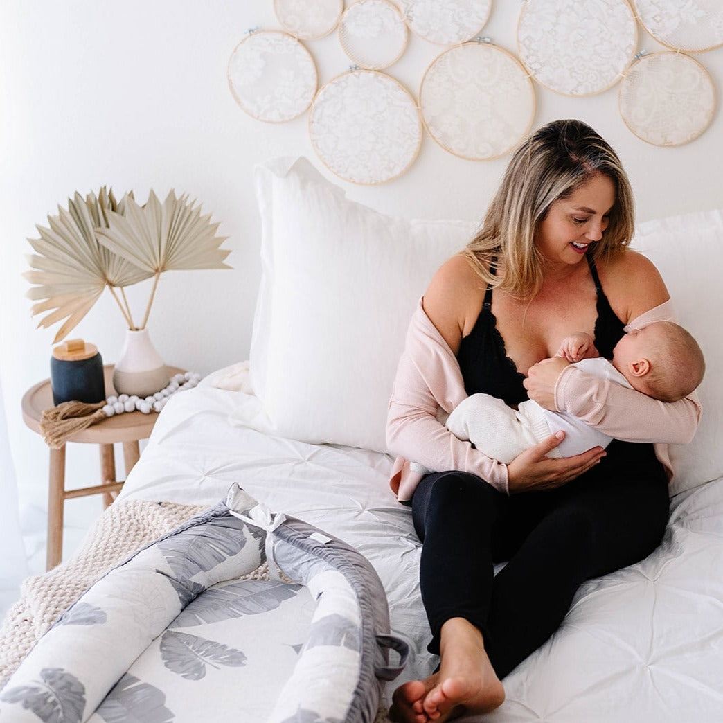mom breastfeeding baby oh la lari black bra